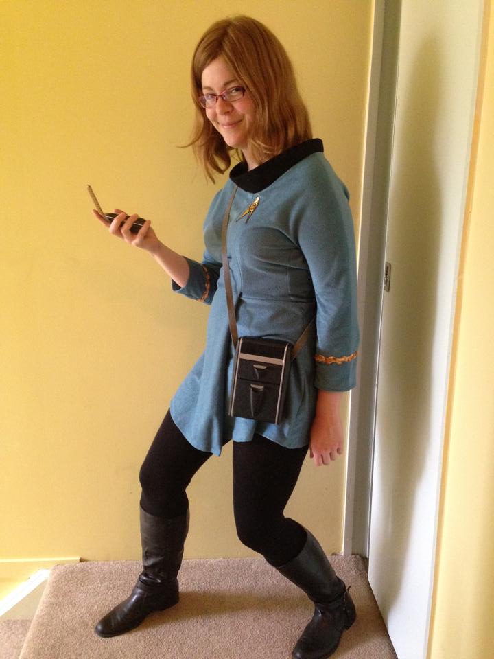 Jarrah inside in the TOS uniform with tricorder and communicator