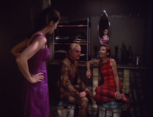 Dax in her party dress finds Odo and Kira talking in her closet