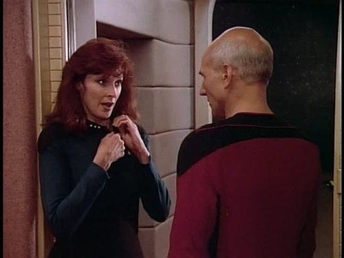 Crusher starts to undo her uniform for Picard