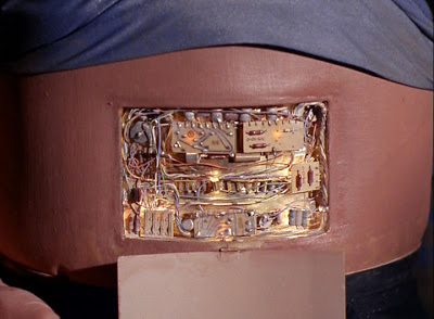 A panel hiding machinery in Norman's abdomen