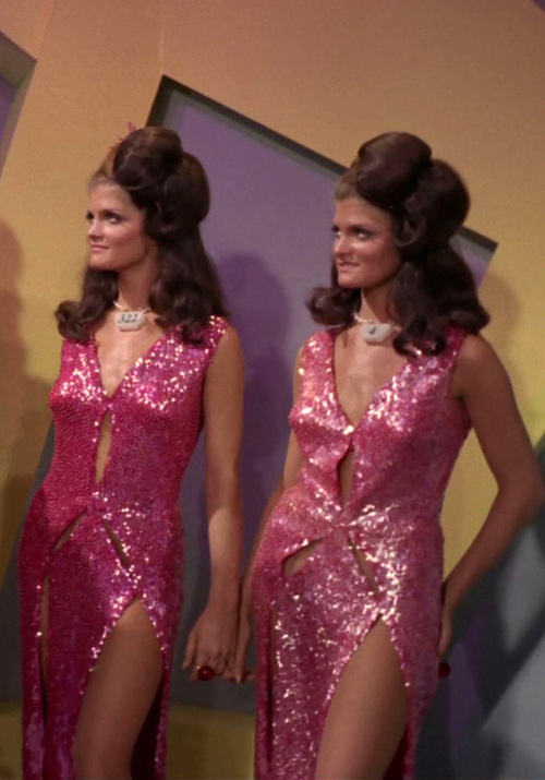Two android twins in pink sequin dresses