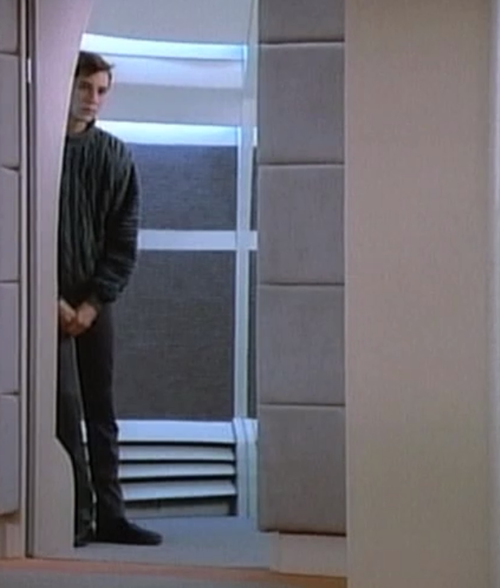 Wesley Crusher peers out of the turbolift.