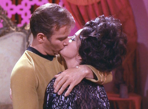Sylvia and Kirk kiss