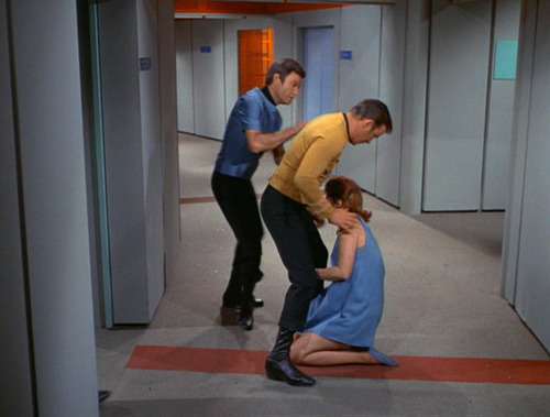 Kirk knocks out Lester in the corridor