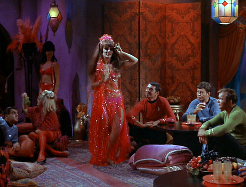 Belly dancer performs as Scotty, McCoy and Kirk watch