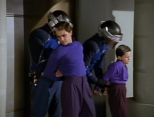 Rutian officers arresting two boys