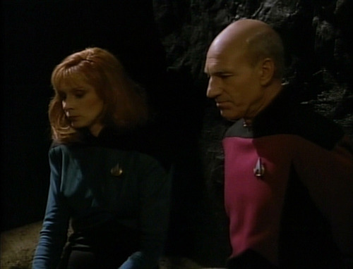 Picard and Crusher talk in the cave