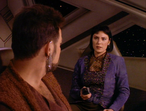 Ro holds a phaser pointed at Riker