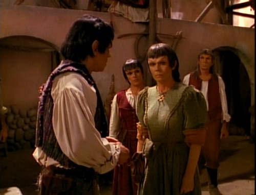 Nuria talks to Oji as Troi looks on