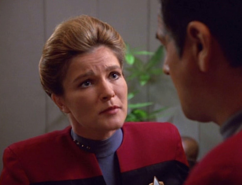 Janeway looks sympathetically at Chakotay
