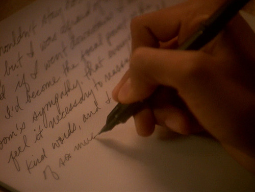 Jake Sisko writes with pen on paper
