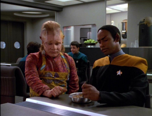 Neelix and Tuvok talk in the mess hall about fatherhood