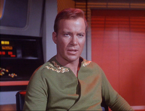Captain Kirk in green wrap shirt