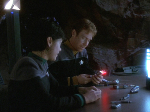 Exri and Kellin work on reconfiguring tricorders