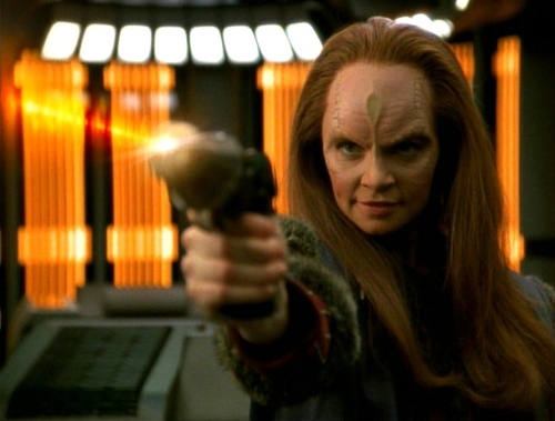Seska with a phaser after being discovered to be a Cardassian.