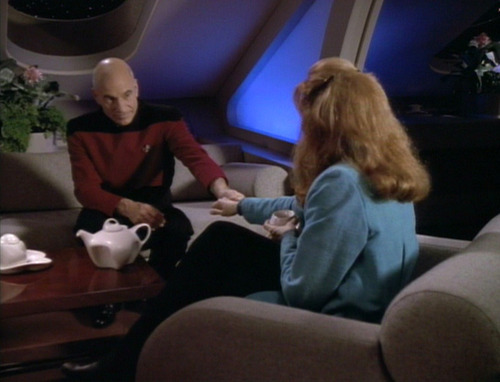 Picard and Crusher clasp hands over tea