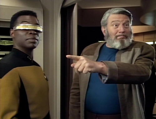 Sergey Rozhenko points at something in Engineering as Geordi looks