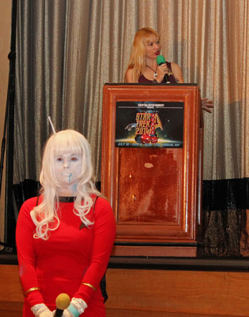 Mary Czerwinski at a podium and Karine Marois as an Andorian TOS officer in front