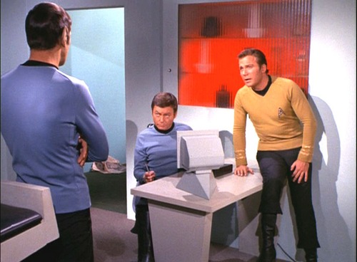 Kirk, Spock and McCoy talk in Sickbay