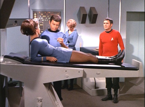 Romaine sits up in Sickbay