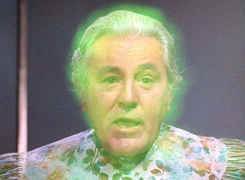 Gorgan - an old white man in a floral robe, who glows green