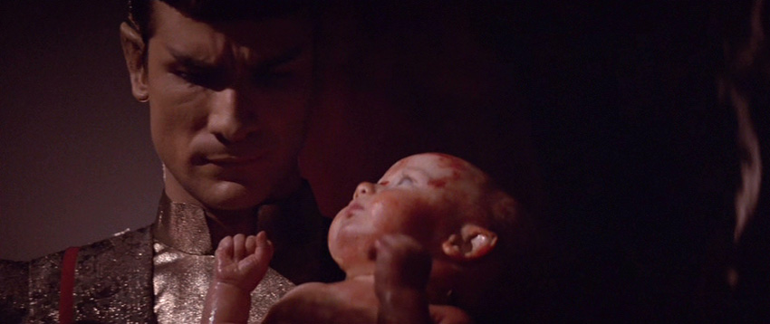 Sarek holds a newborn baby Spock