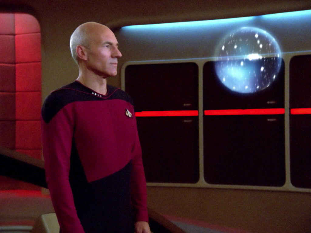 Picard looks at the orb on the bridge