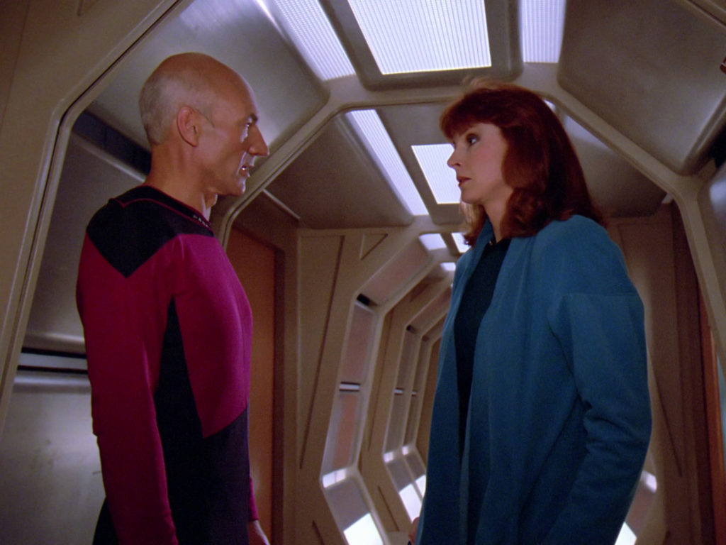 Picard and Crusher argue in the corridor