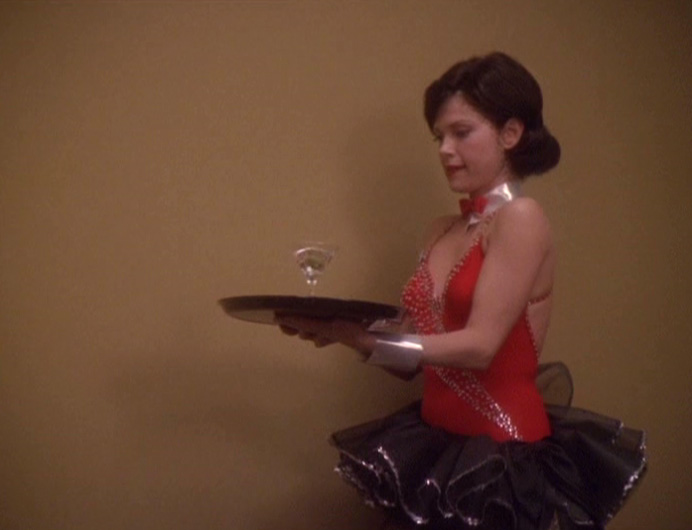 Ezri carrying a drink on a tray
