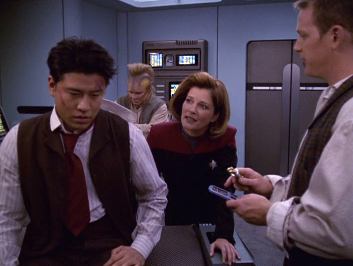 Janeway talks to an injured Kim