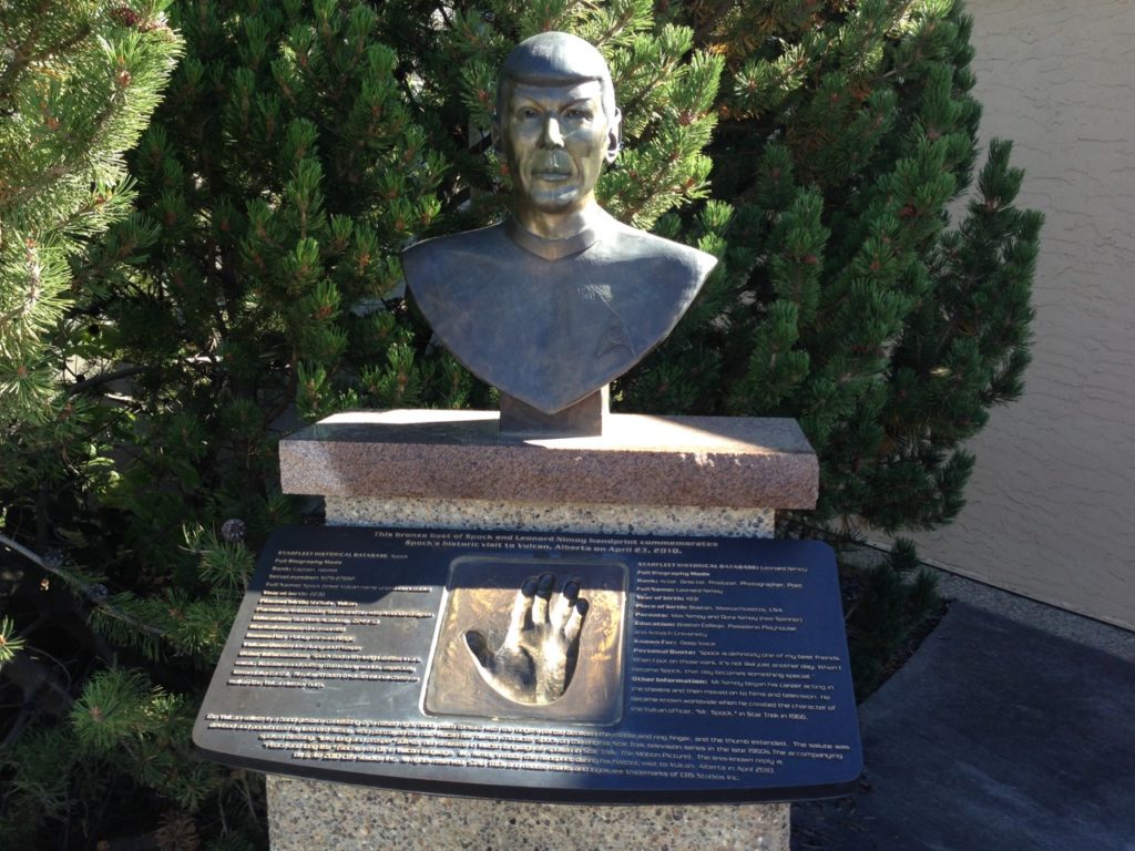 Bust of Spock with Leonard Nimoy's handprint in cement making the Vulcan sign
