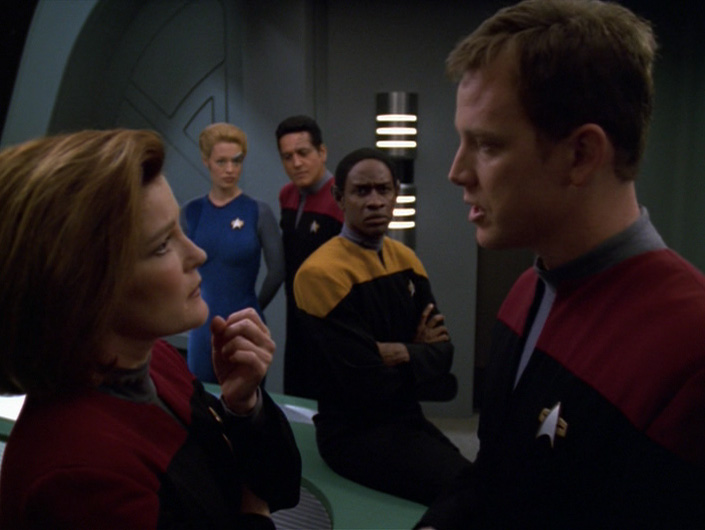 Janeway talks to Paris in the briefing room