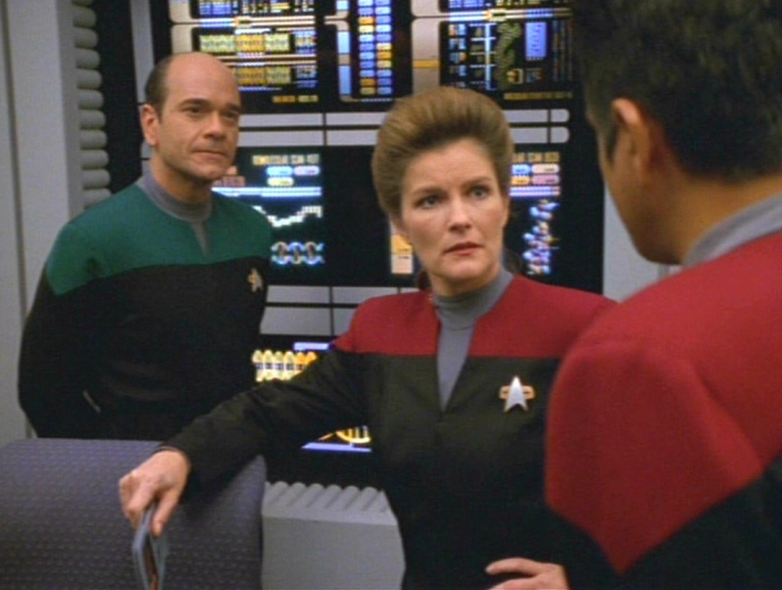 The Doctor, Janeway and Chakotay discuss the problem