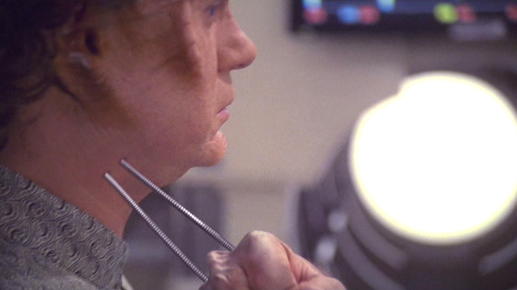 Borg probes going into Phlox's neck