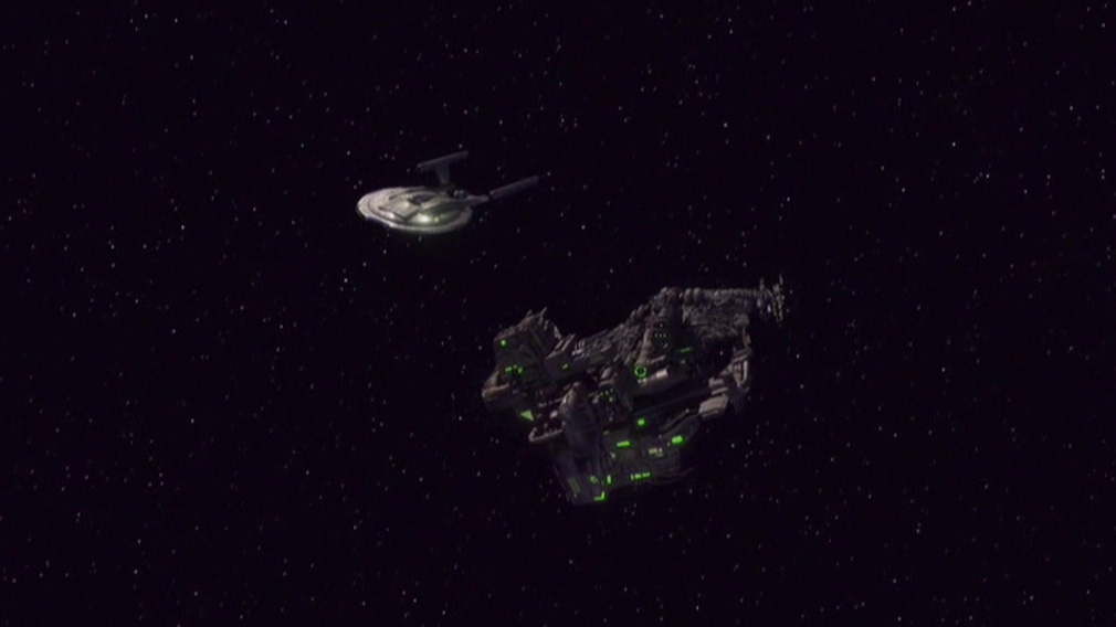 Assimilated transport ship floating off the bow of Enterprise