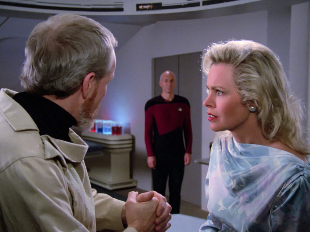 Dr. Manheim and Jenice Manheim talking in the lab when Picard walks in