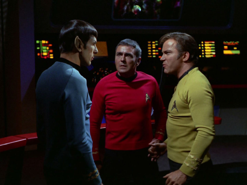 Spock, Scotty and McCoy on the bridge after the fight is over