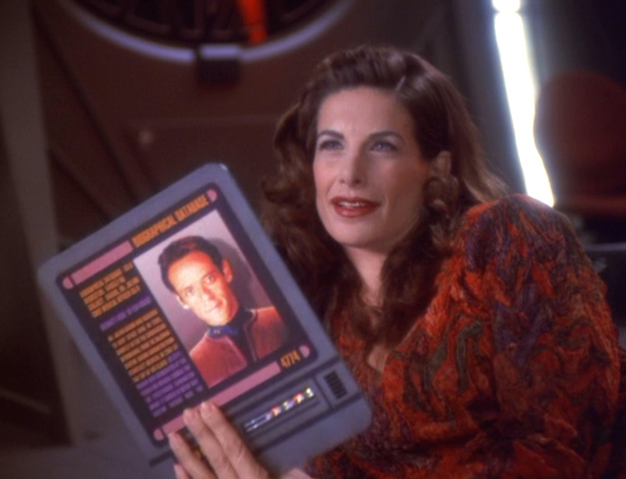 Lauren lounges sexily and shows Jack a PADD with a picture of Bashir on it