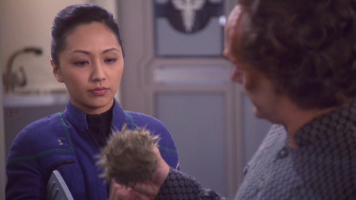 Hoshi looks at Phlox holding a tribble