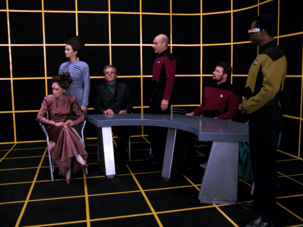 The characters at the hearing in the holodeck
