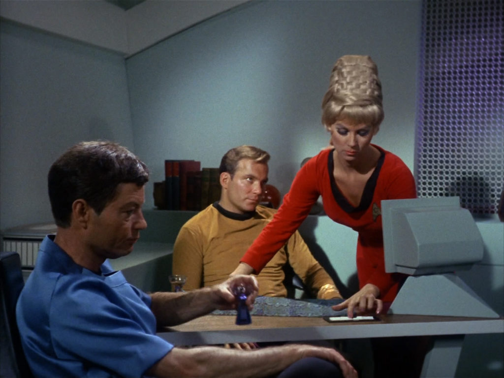 Rand brings Kirk dinner as he talks to McCoy