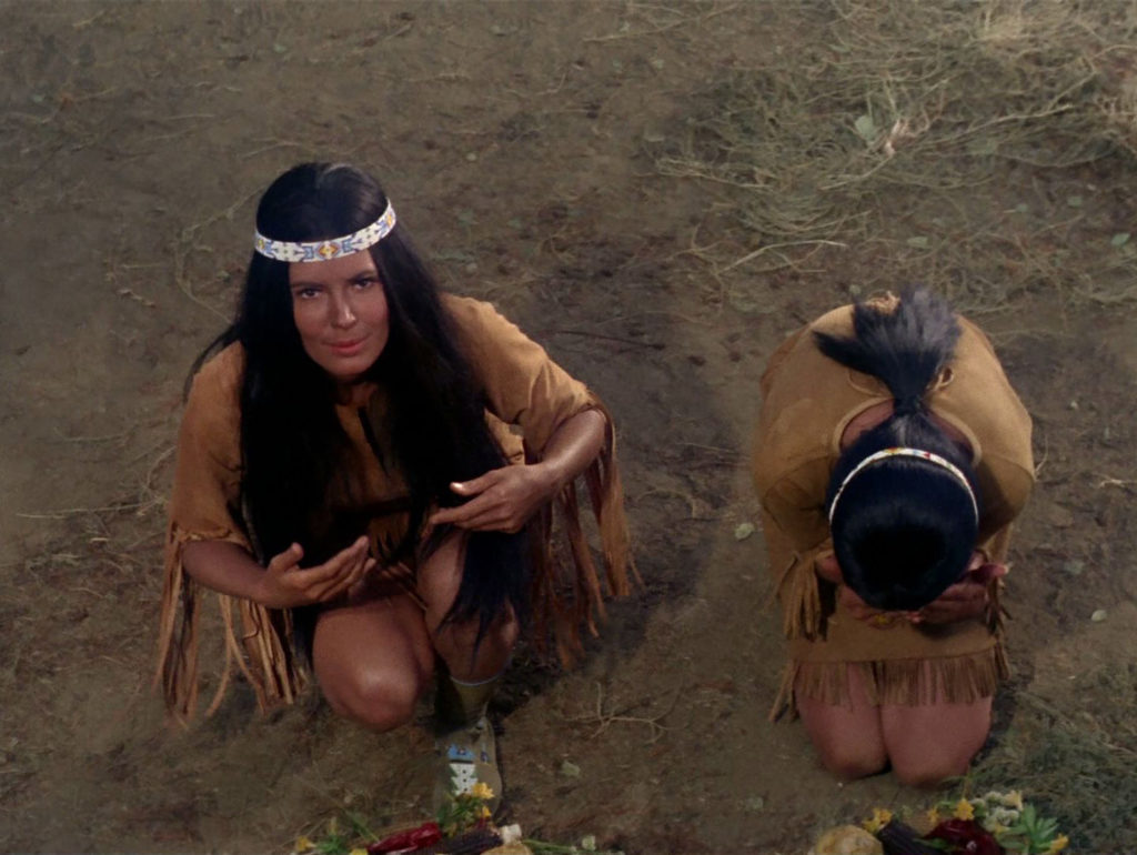 Miramanee and another Native woman bow to Kirk