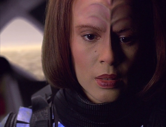 B'Elanna prepares to jump out of the back of a shuttlecraft on the holodeck