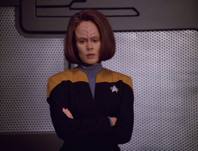 B'Elanna stands staring vacantly in the cargo bay
