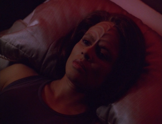 B'Elanna in bed, staring at the ceiling