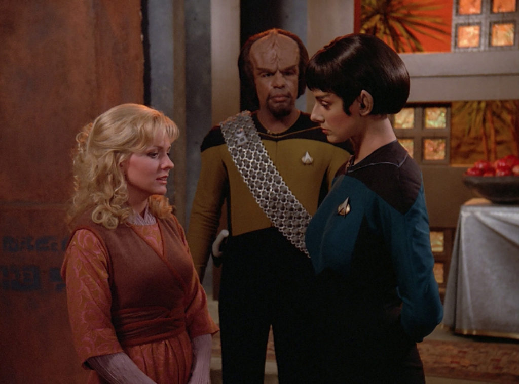 Dr. Selar and Worf talk to Kareen